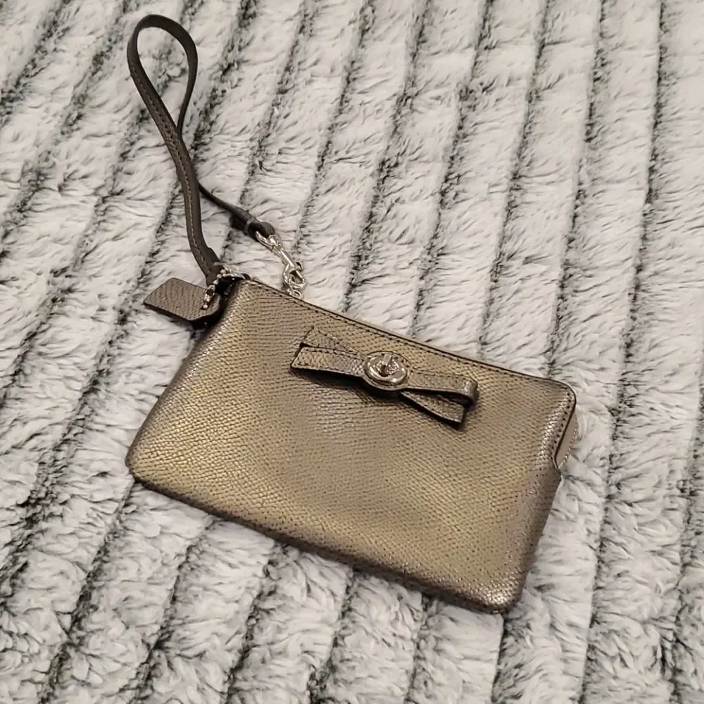 Cute metallic Coach bow wristlet
